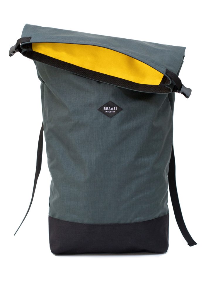 The Braasi Basic Side in gray with yellow inner lining, a high quality backpack made from locally sourced materials.