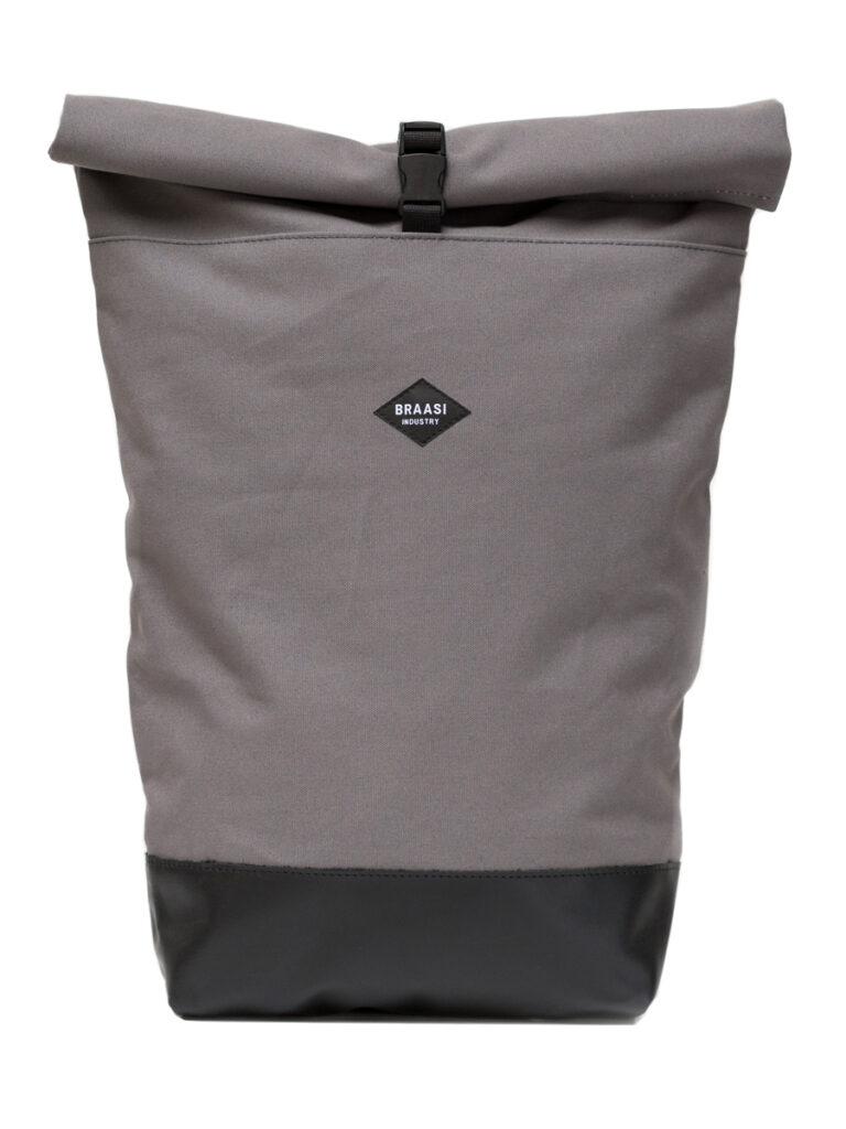 The Rolltop Canvas Braasi backpack in light grey with a black leather bottom