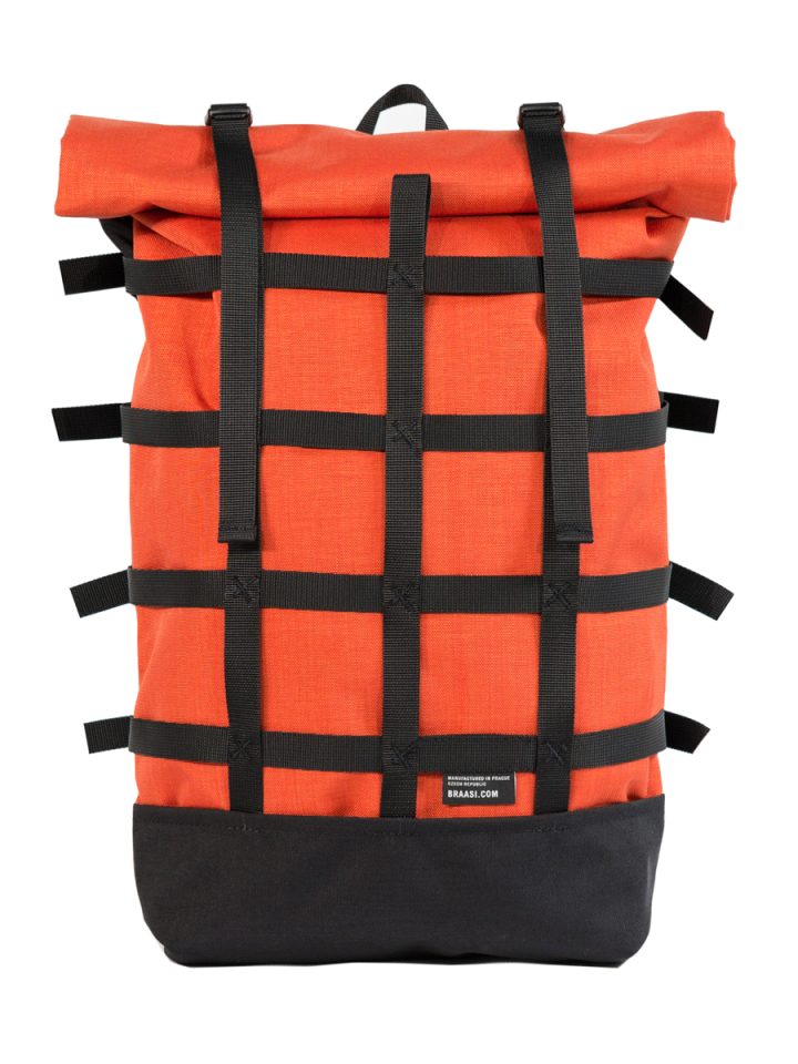 The Braasi Webbing rolltop, here in orange, is a practical backpack made with durable materials.