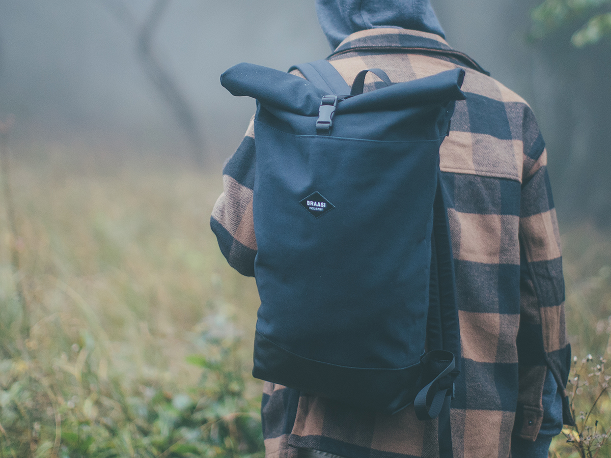 Simplistic Urban rolltop backpack made out of cotton canvas and Italian leather with water resistant lining.